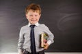 Cute boy against blackboard Royalty Free Stock Photo