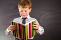 Cute boy against blackboard Royalty Free Stock Photo