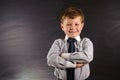 Cute boy against blackboard Royalty Free Stock Photo