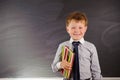 Cute boy against blackboard Royalty Free Stock Photo