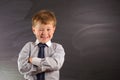 Cute boy against blackboard Royalty Free Stock Photo