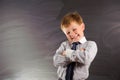 Cute boy against blackboard Royalty Free Stock Photo