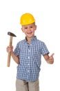 Cute boy in blue checkered shirt and yellow building helmet, holding a hammer in one hand and showing thumbs up Royalty Free Stock Photo