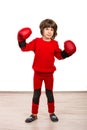 Cute boy with boxing gloves showing fists Royalty Free Stock Photo