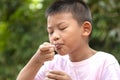 Portrait of a cute boy eating ice cream.