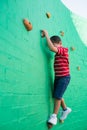 Cute boy climbing wall at playground Royalty Free Stock Photo