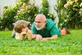 Cute boy with dad playing outdoor. Child with Grandfather dreams in summer in nature. Happy family Grandson hugs his