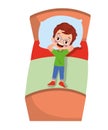 Cute boy daydreaming lying on his bed Royalty Free Stock Photo