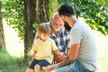 Cute boy developing chess strategy. Father son and grandfather relaxing together. Golden age grandfather. Three Royalty Free Stock Photo
