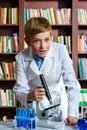 Cute boy doing biochemistry research in chemistry Royalty Free Stock Photo