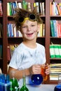 Cute boy doing biochemistry research in chemistry Royalty Free Stock Photo