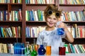 Cute boy doing biochemistry research in chemistry Royalty Free Stock Photo