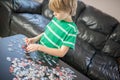 Cute boy doing a puzzle Royalty Free Stock Photo