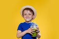 Cute boy Drink Mojito cocktail From Plastic Cup Over Yellow Studio Background Royalty Free Stock Photo