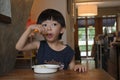 Cute boy eating food your himself have fun Royalty Free Stock Photo