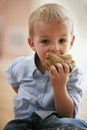 Cute boy eating healthy sandwich. Royalty Free Stock Photo