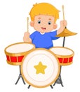 a cute boy enthusiastically plays a drum set