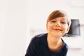 Cute boy with a face painted as a clown, smiling Royalty Free Stock Photo