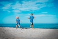 Cute boy and girl dance at beach, kids enjoy tropical vacation Royalty Free Stock Photo