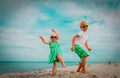 Cute boy and girl dance at beach, kids enjoy vacation at sea Royalty Free Stock Photo