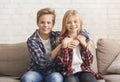 Cute Boy And Girl Hugging Sitting On Sofa At Home Royalty Free Stock Photo