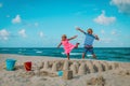 Cute boy and girl play with sand on beach vacation Royalty Free Stock Photo
