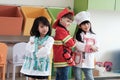 Cute boy and girls playing as fireman, doctor and cook occupation in kindergarten class, kid occupation, education concept Royalty Free Stock Photo