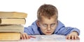 Cute boy in glasses of school age is tired of learning. I hung my head on textbooks. Close-up. Isolated on a white background