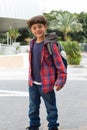 Cute boy going to school with backpack