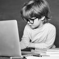 Cute boy with happy face expression near desk with school supplies. Private school. Teachers day. Ready for school Royalty Free Stock Photo