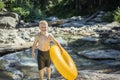 Cute Boy having fun riding an inflatable tube on a summers day Royalty Free Stock Photo