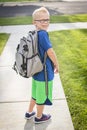 Cute boy heading off to school in the morning