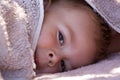 Cute boy hiding under towel Royalty Free Stock Photo