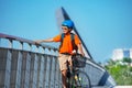 Cute boy hold handrail of bridge sit on bicycle Royalty Free Stock Photo