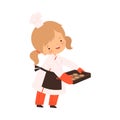 Cute Boy Holding Baking Cookies, Cute Little Chef Character in Uniform Cooking in the Kitchen Cartoon Style Vector Royalty Free Stock Photo