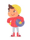 Cute boy holding ball, isolated child in red jacket, beanie hat, jeans and boots standing