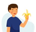 Cute boy is holding a banana. Guy eating fruit isolated on a white background. Healthy food concept, healthy snack. Royalty Free Stock Photo