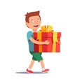 Cute boy holding big ribbon bow wrapped gift box Royalty Free Stock Photo