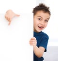 Cute boy is holding blank banner Royalty Free Stock Photo
