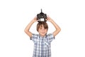 Cute boy holding a drone remote control above his head Royalty Free Stock Photo