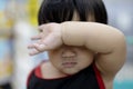 Boy Holding His Arm In Front Of His Face Royalty Free Stock Photo