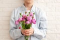 Cute boy holding pink roses bunch flowers for mother. Mother`s Day concept Royalty Free Stock Photo