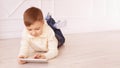 Cute boy playing Computer tablet and chat on floor Royalty Free Stock Photo