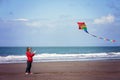 Cute boy with kite on the beach Royalty Free Stock Photo