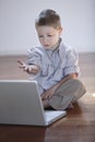 Cute boy with laptop computer Royalty Free Stock Photo