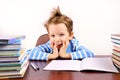 Cute boy laughing sitting at the desk Royalty Free Stock Photo