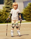 Cute Boy learning rollerblading Royalty Free Stock Photo