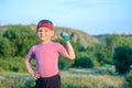 Cute Boy Lifting Dumbbell with Right Hand on Waist Royalty Free Stock Photo