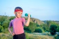 Cute Boy Lifting Dumbbell with Right Hand on Waist Royalty Free Stock Photo