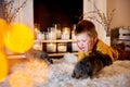 a cute boy lying thoughtfully with grey rabbits around him Royalty Free Stock Photo